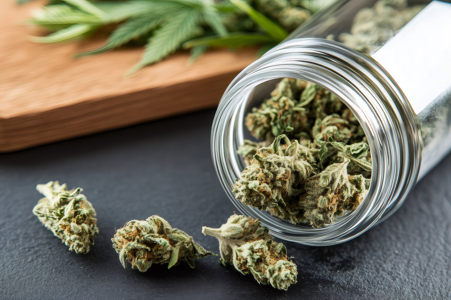 cannabis buds cascading from glass